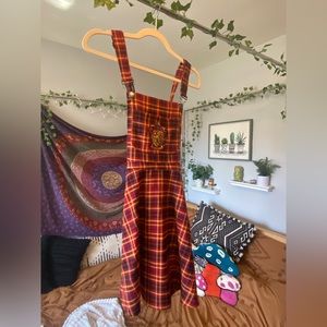 Harry Potter Gryffindor red & yellow plaid overall dress from Hot Topic. Size S